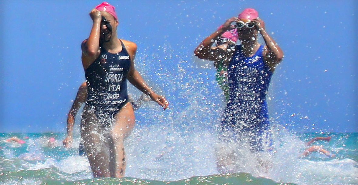 Swimmers racing in a pool